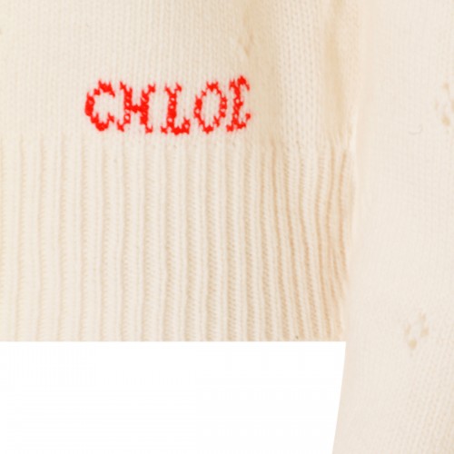 WHITE WOOL KNITWEAR