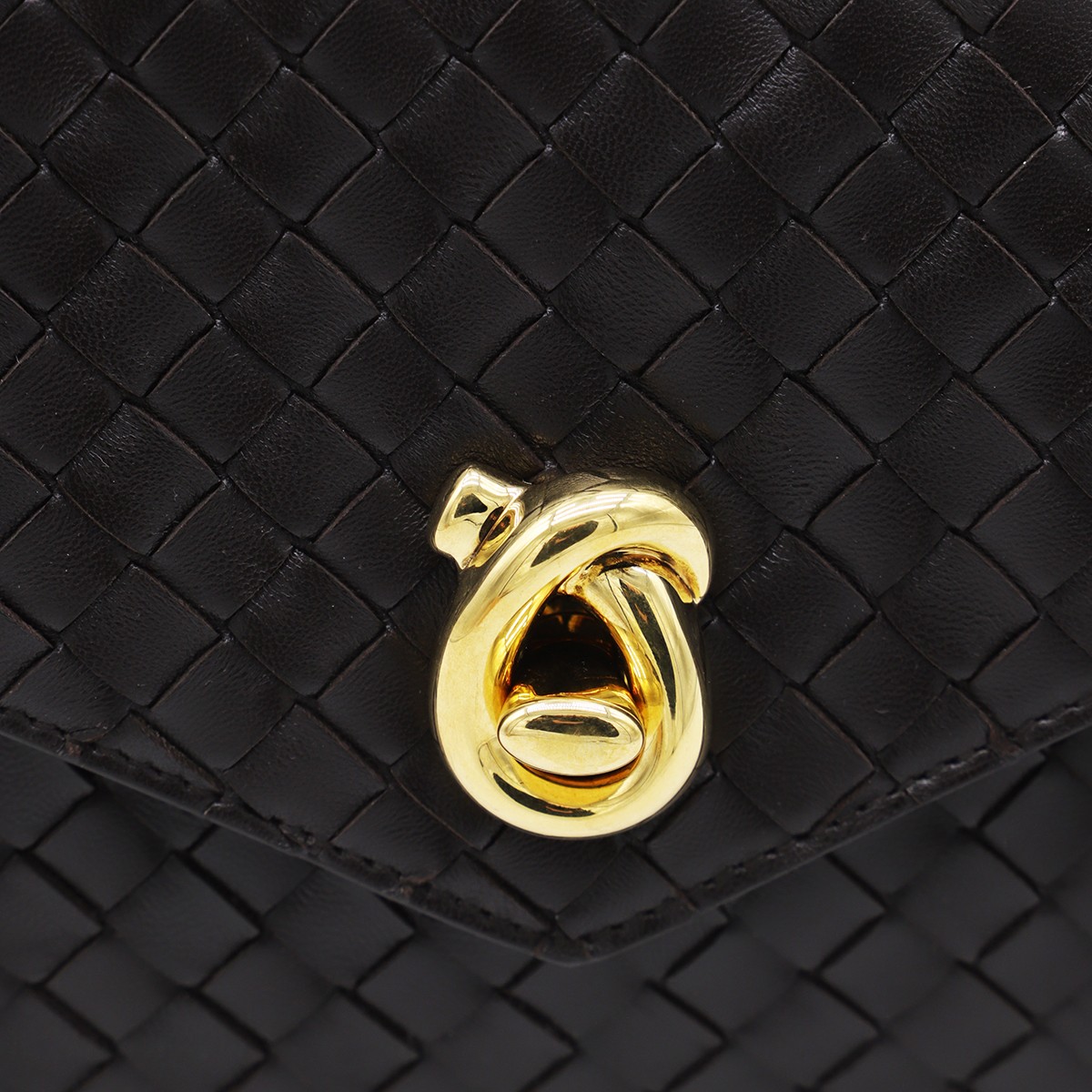 DARK BROWN LEATHER KNOT LOCK TOP...