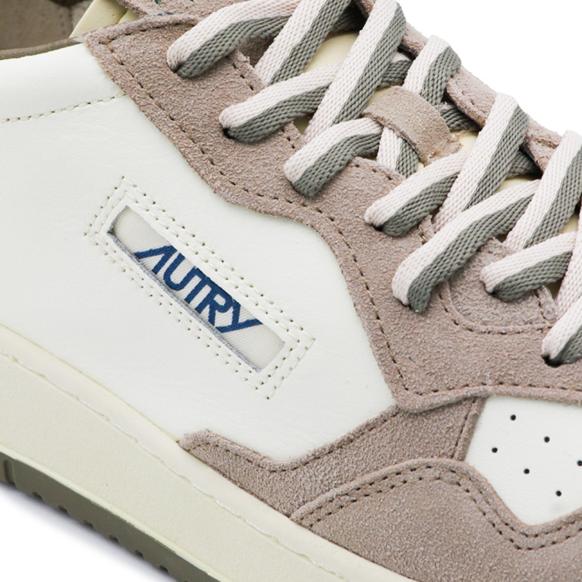 WHITE AND BEIGE LEATHER MEDALIST...